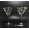 przezroczyste kryształowe szklanki martini ze złotą obręczą